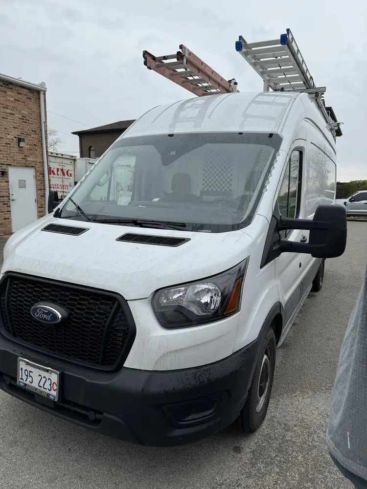 Commercial cargo van getting mobile auto glass service in the SW Chicago suburbs