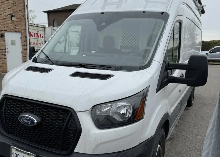 Commercial cargo van getting mobile auto glass service in the SW Chicago suburbs