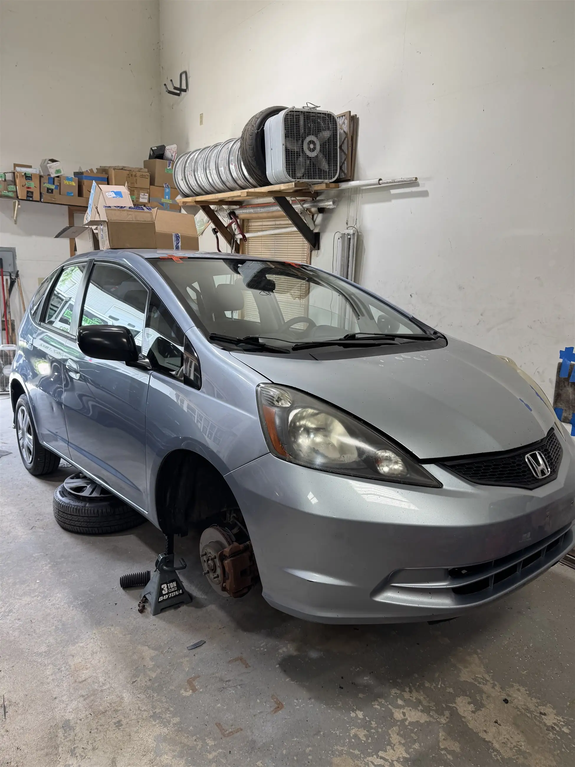 Mobile sedan windshield replacement in progress at a shop in the SW Chicago suburbs