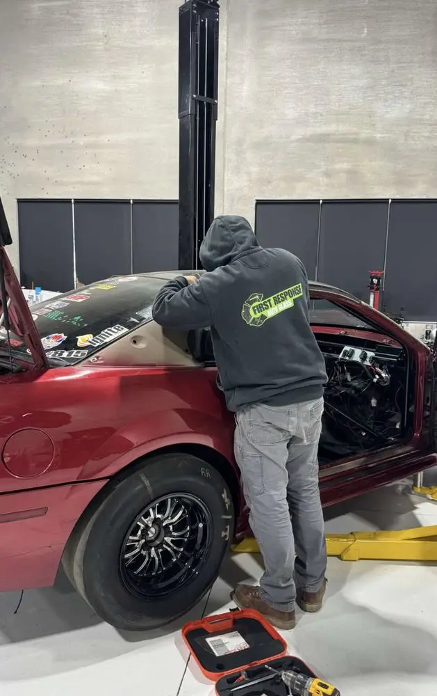 First Response Auto Glass technician replacing vehicle glass on-site in the SW Chicago suburbs
